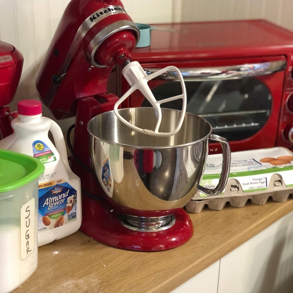 red kitchen aid mixer with pancake ingredients