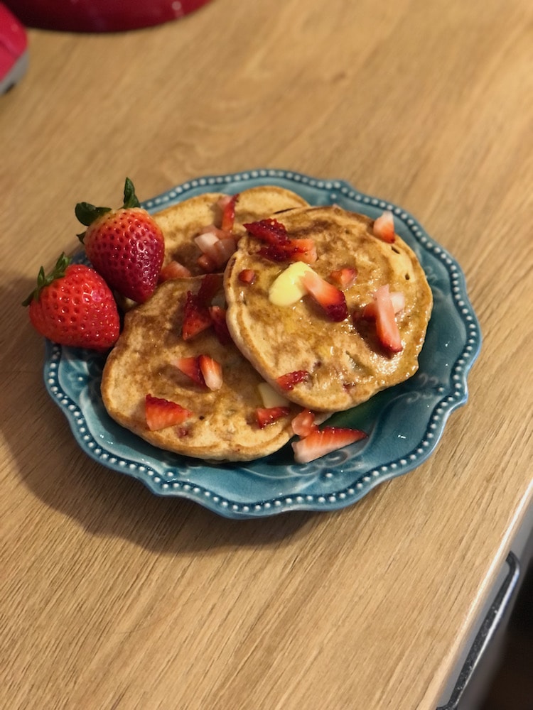 pancakes on blue plate with strawberries